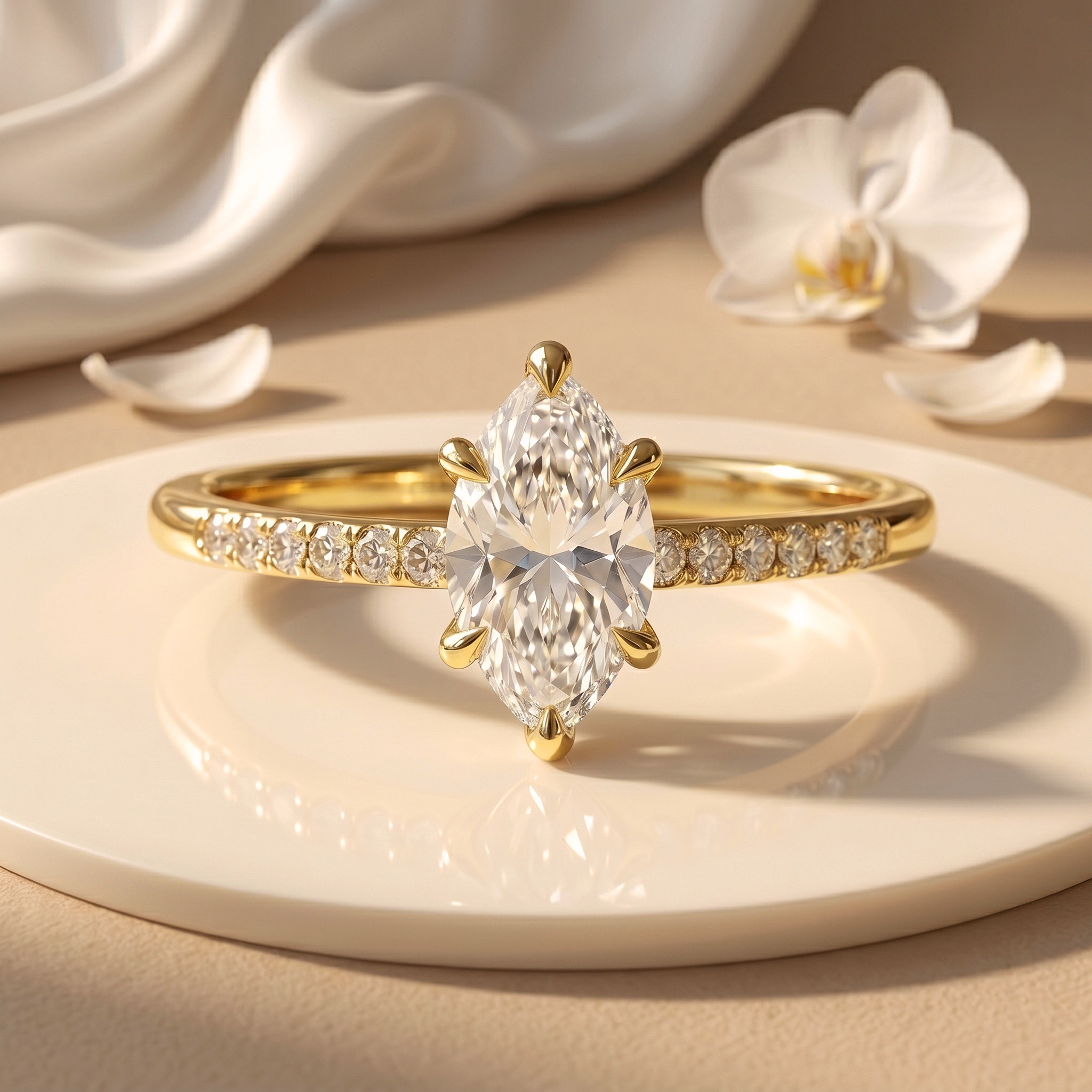 A stunning yellow gold engagement ring featuring a marquise-cut moissanite center stone and a diamond-paved band.