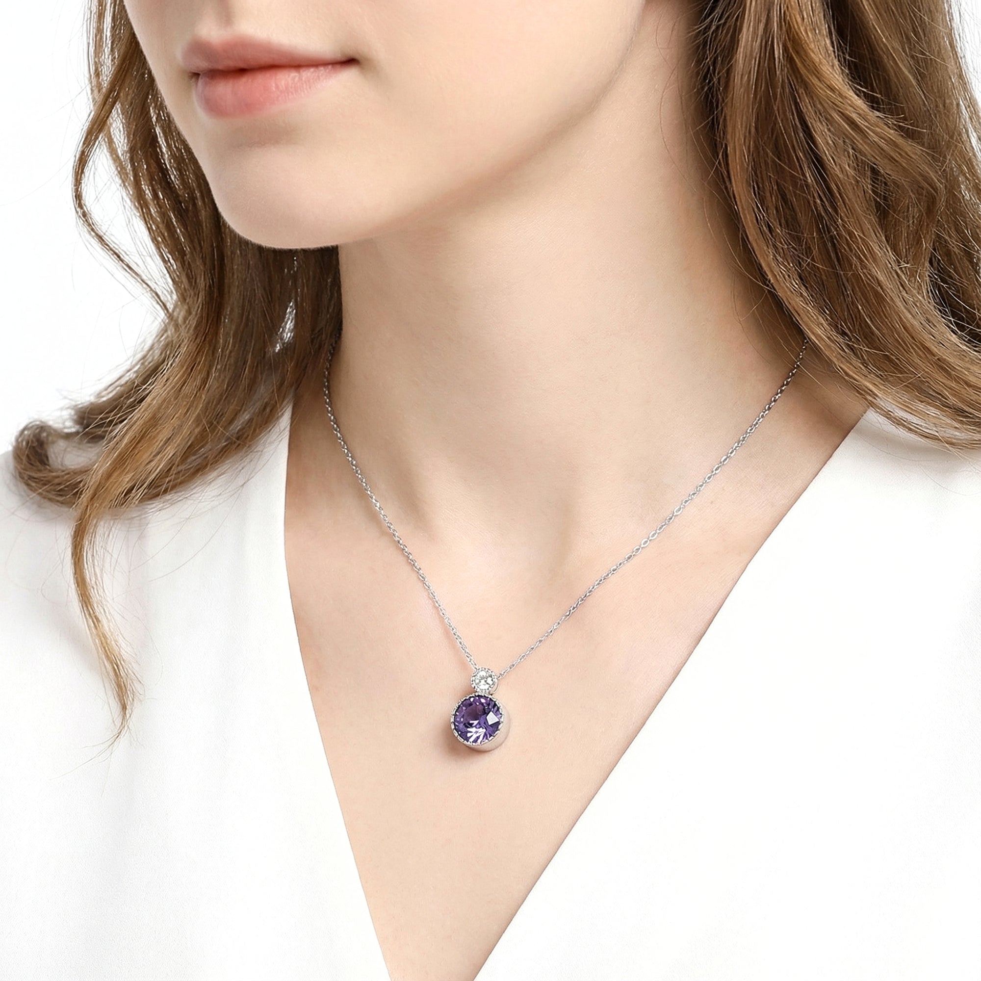 Model wearing the Elara round simulated amethyst drop necklace in sterling silver on a delicate chain.
