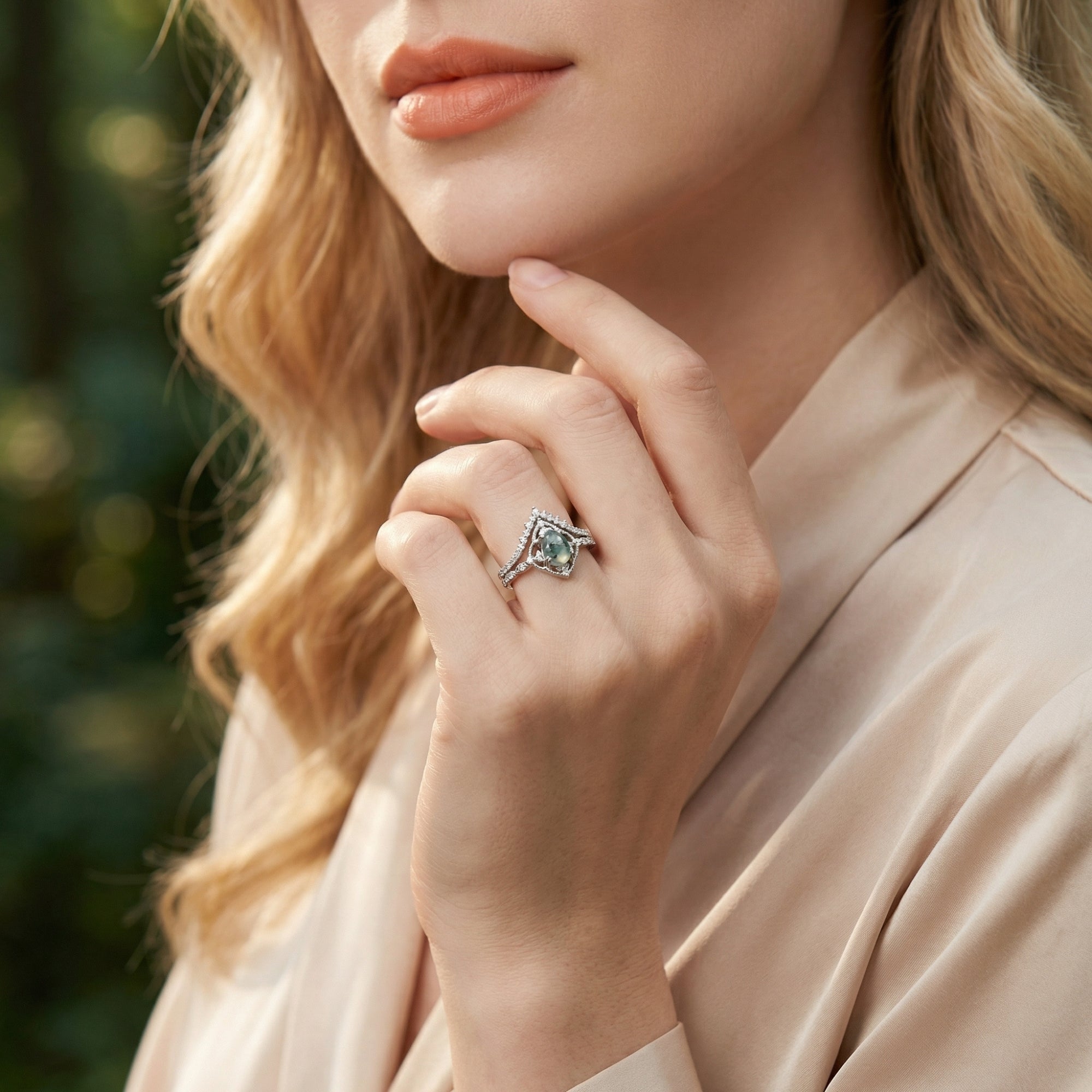 Sterling silver moss agate ring set worn by a model, showcasing the unique natural stone and diamond accents.