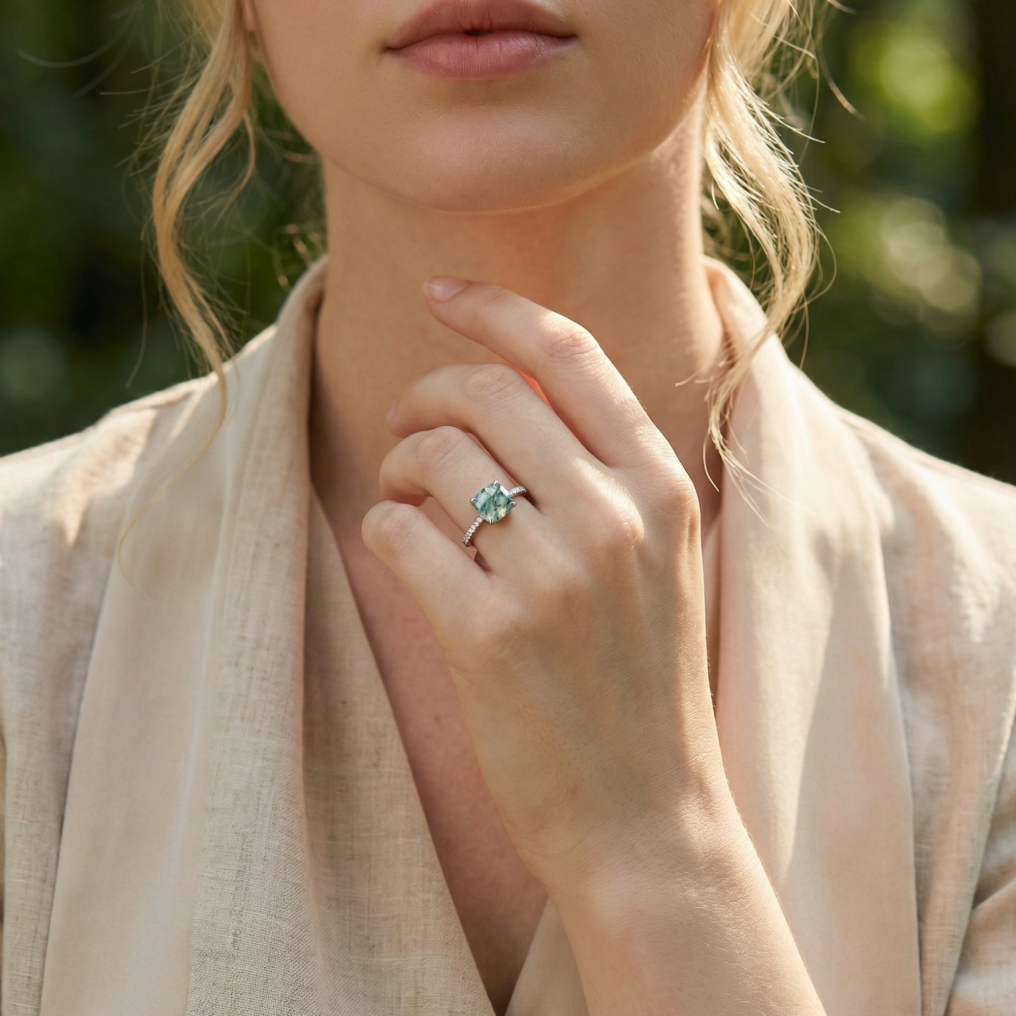 A model wearing the cushion cut moss agate pavé ring in S925 sterling silver against a soft background.