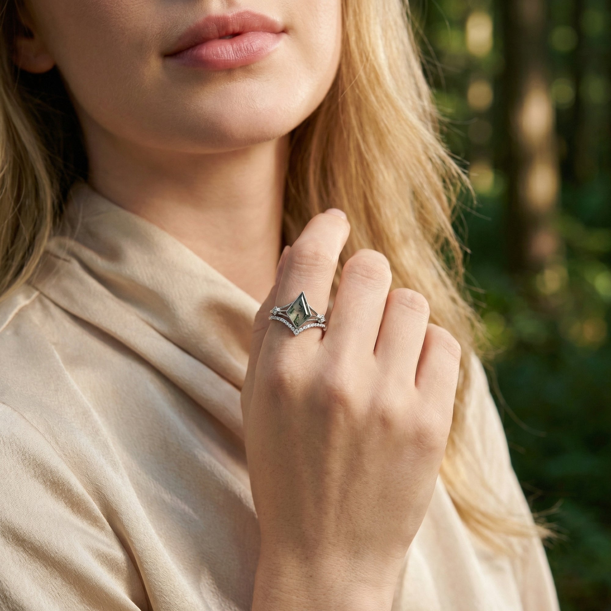 Close-up of a model wearing the kite cut moss agate S925 sterling silver ring set, showcasing its fit on the hand.