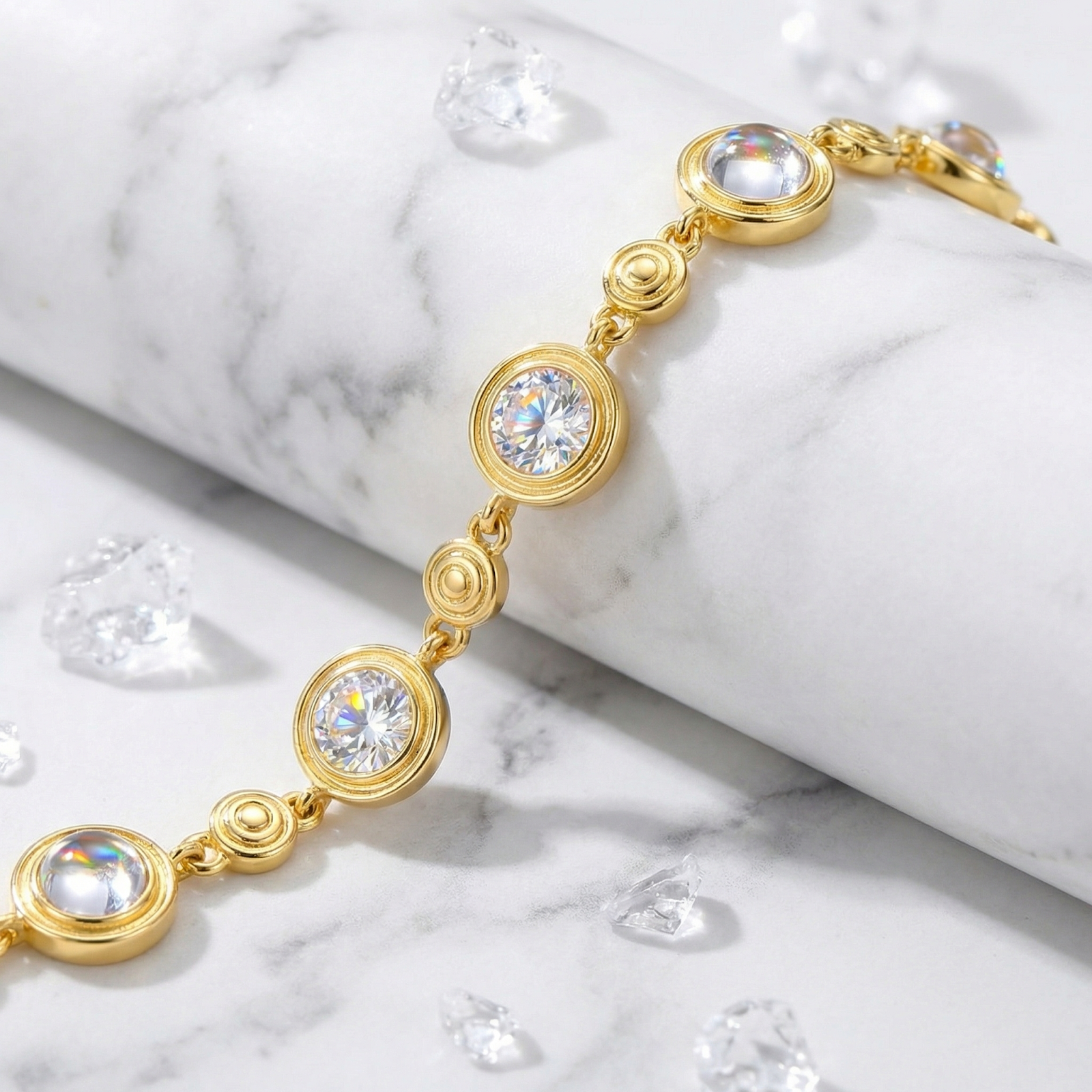 Macro view of round-cut simulated diamonds in gold bezel settings on the Mirellia station bracelet.