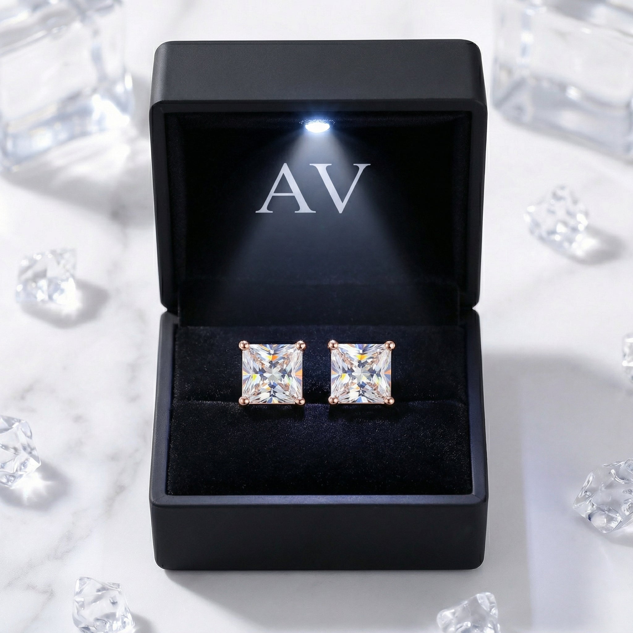 Princess cut zirconia stud earrings in 18K rose gold vermeil presented in a black lighted AV jewelry gift box.