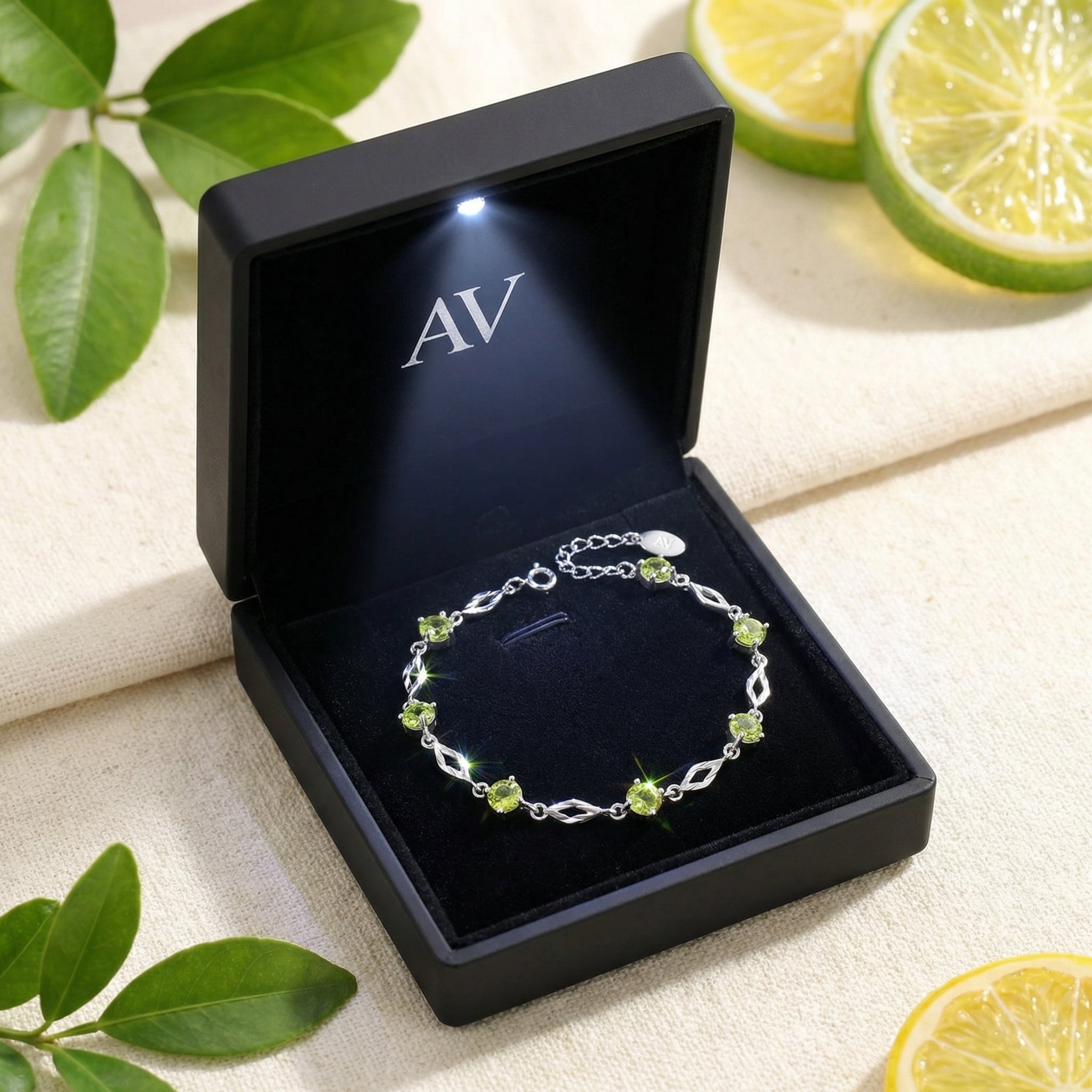 S925 sterling silver simulated peridot station bracelet inside a black LED-lit jewelry gift box.