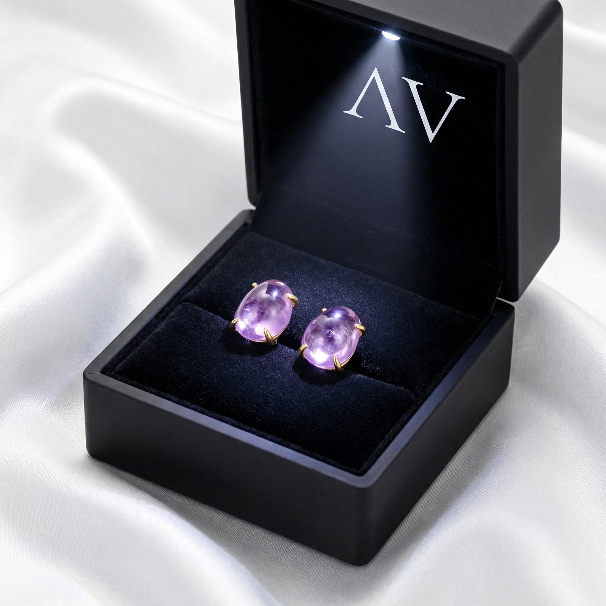 Thalassa 18K gold vermeil purple simulated amethyst stud earrings presented in a black LED-lit jewelry box.