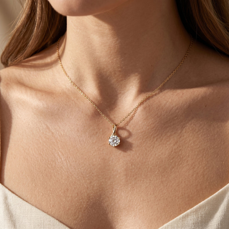 Gold round moissanite twist pendant worn on neck.