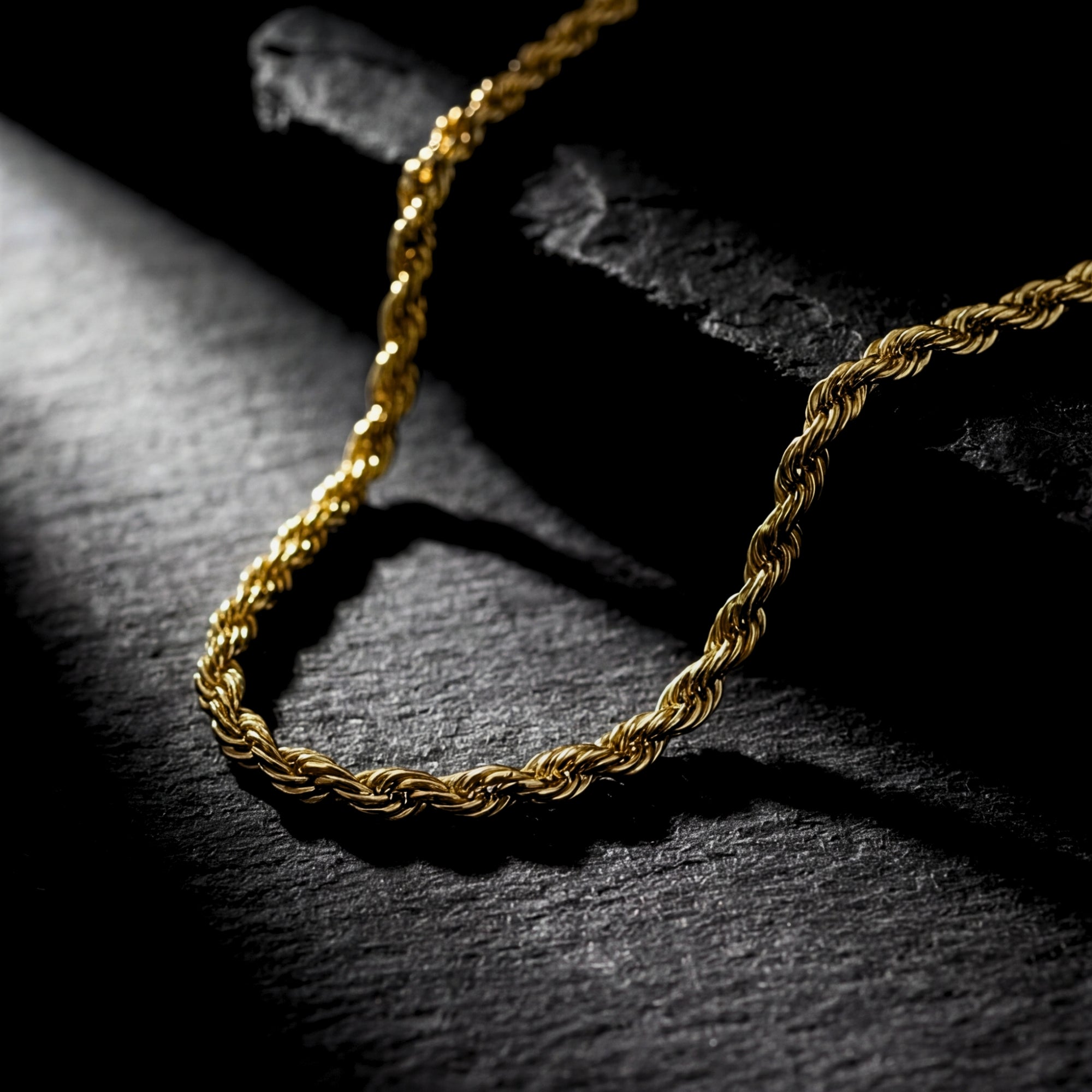 Close-up of a 2.5mm gold stainless steel rope chain showing the intricate twisted link design.