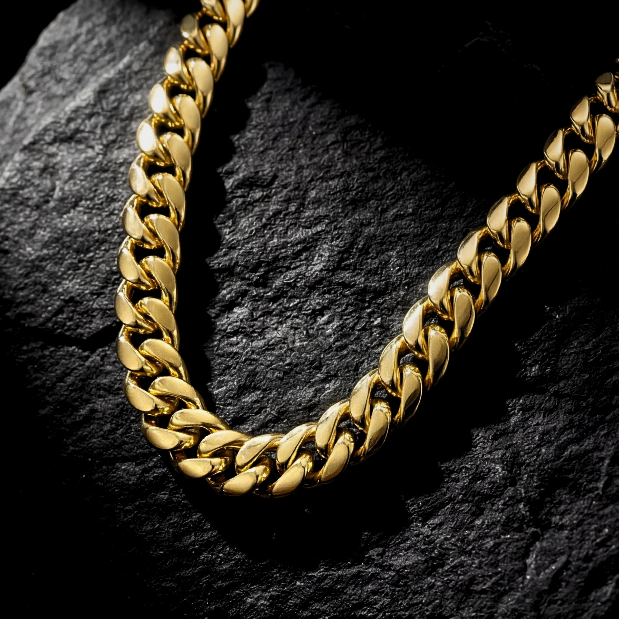 Close-up detail of the polished 10mm gold stainless steel links on the Titan Cuban chain.