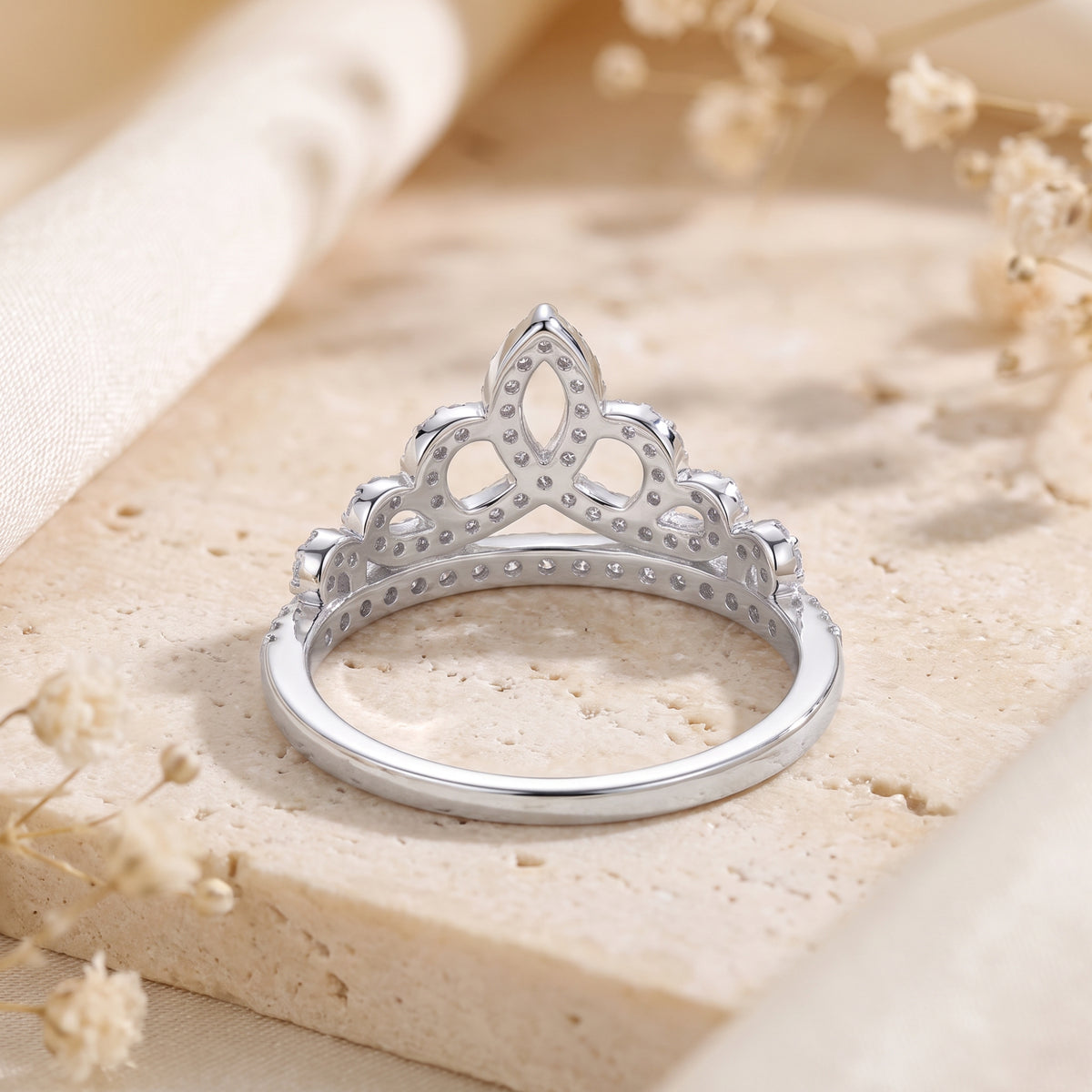 Rear view of the silver tiara ring displaying the inner band and openwork back setting structure.