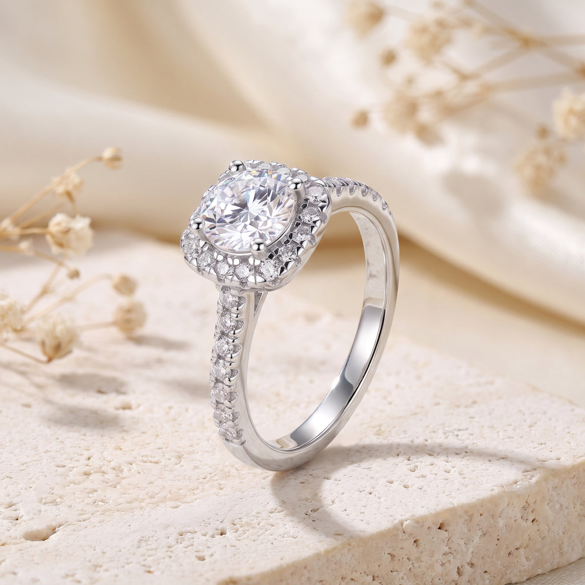 Side profile view of the silver halo ring, showing the prong setting and pave band.