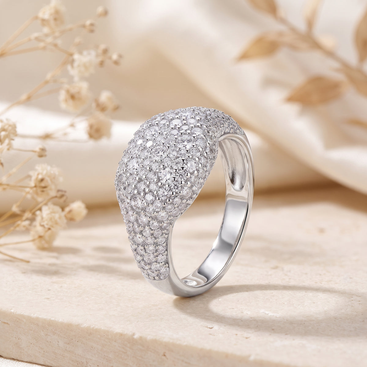 Side angle view of the solid gold pave dome ring in white gold, displaying its thick band profile and stone-set top.