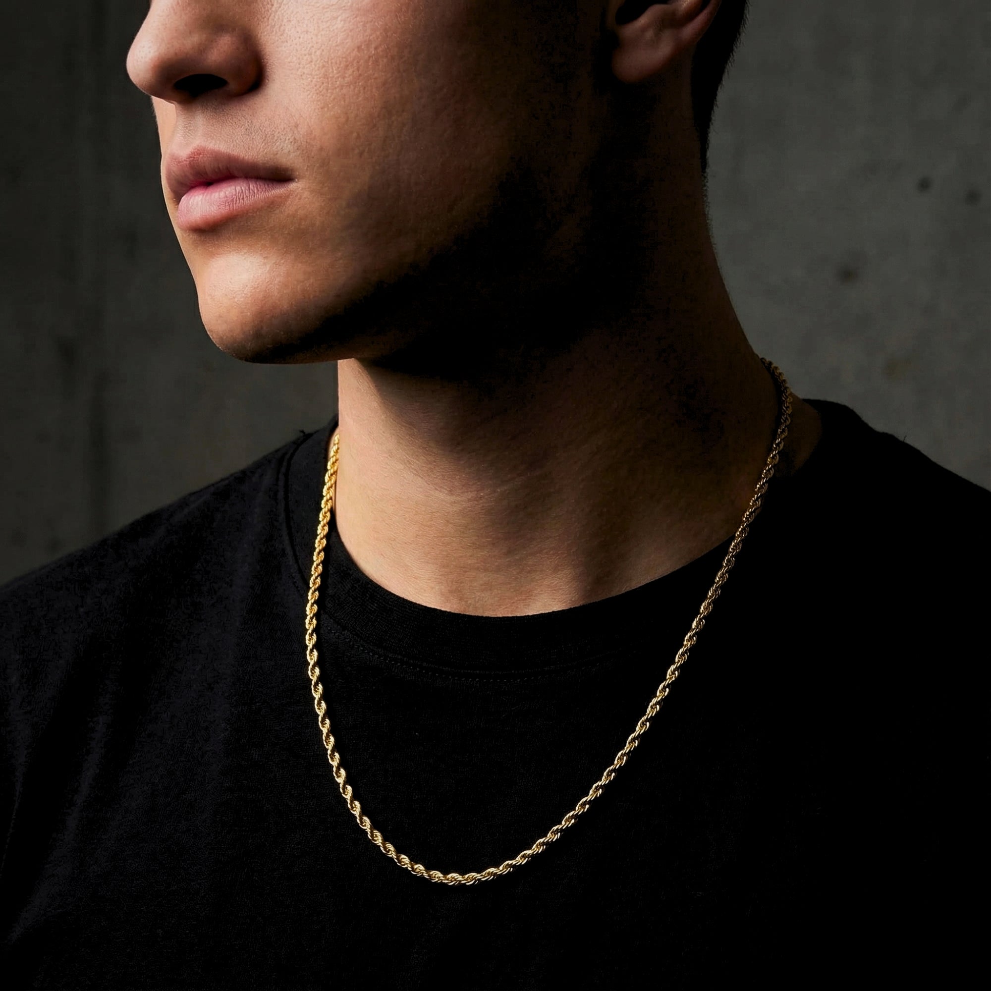 2.5mm gold stainless steel rope chain worn by a man in a black t-shirt.