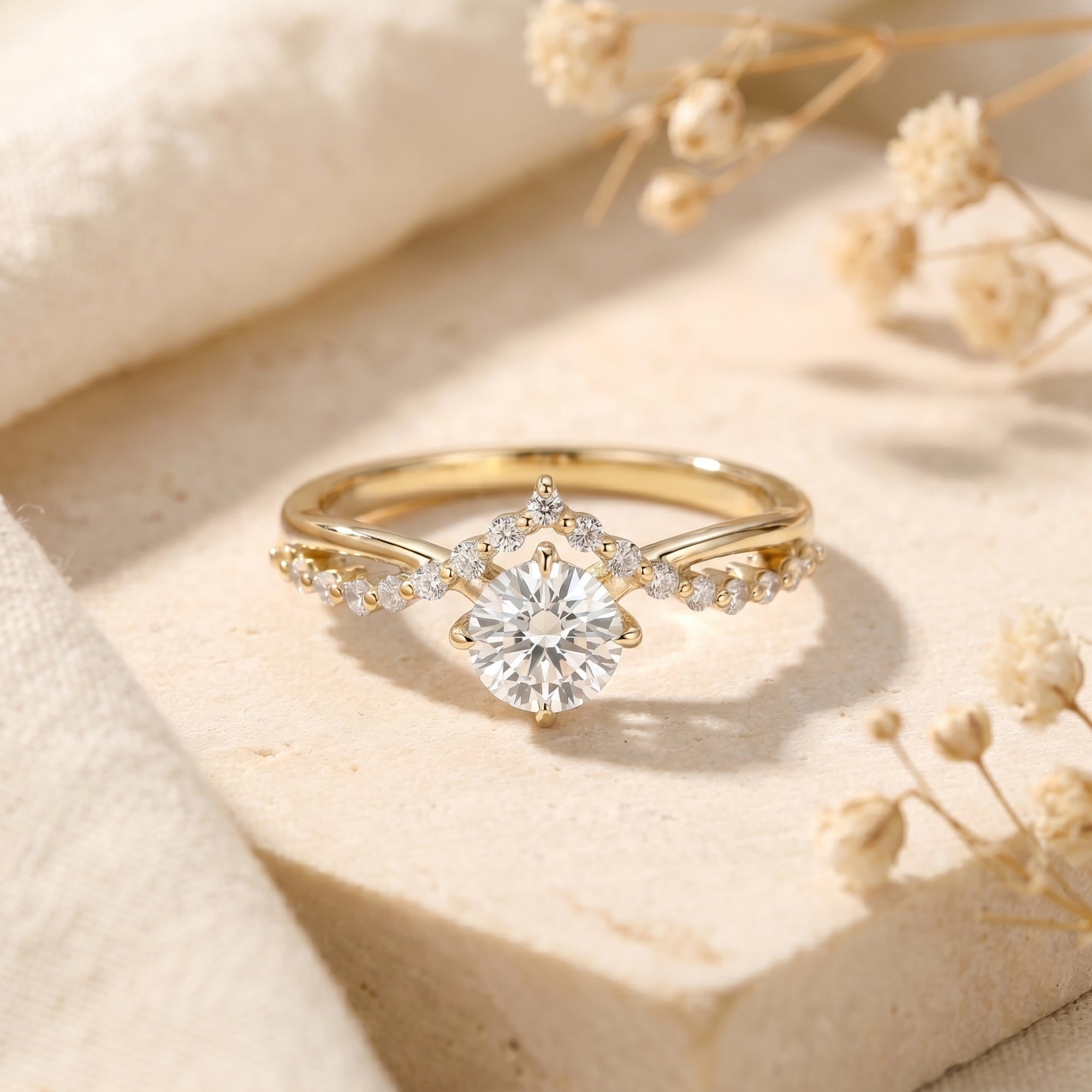 Gold Caladienne crown promise ring featuring a 1-carat round-cut moissanite center stone on a lifestyle background.