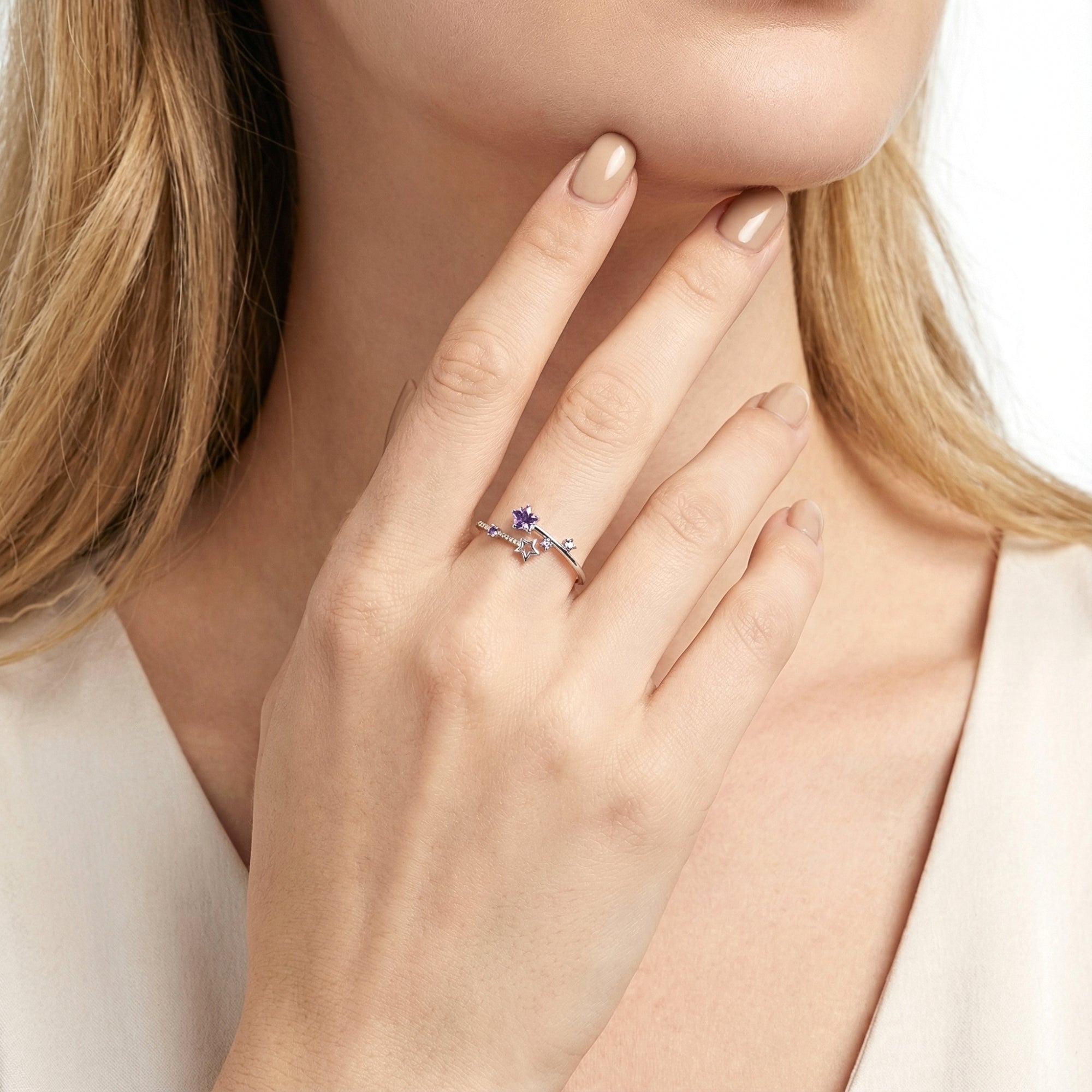 Model wearing the S925 sterling silver Galaxia ring with star-cut Deep Siberian purple simulated amethyst.