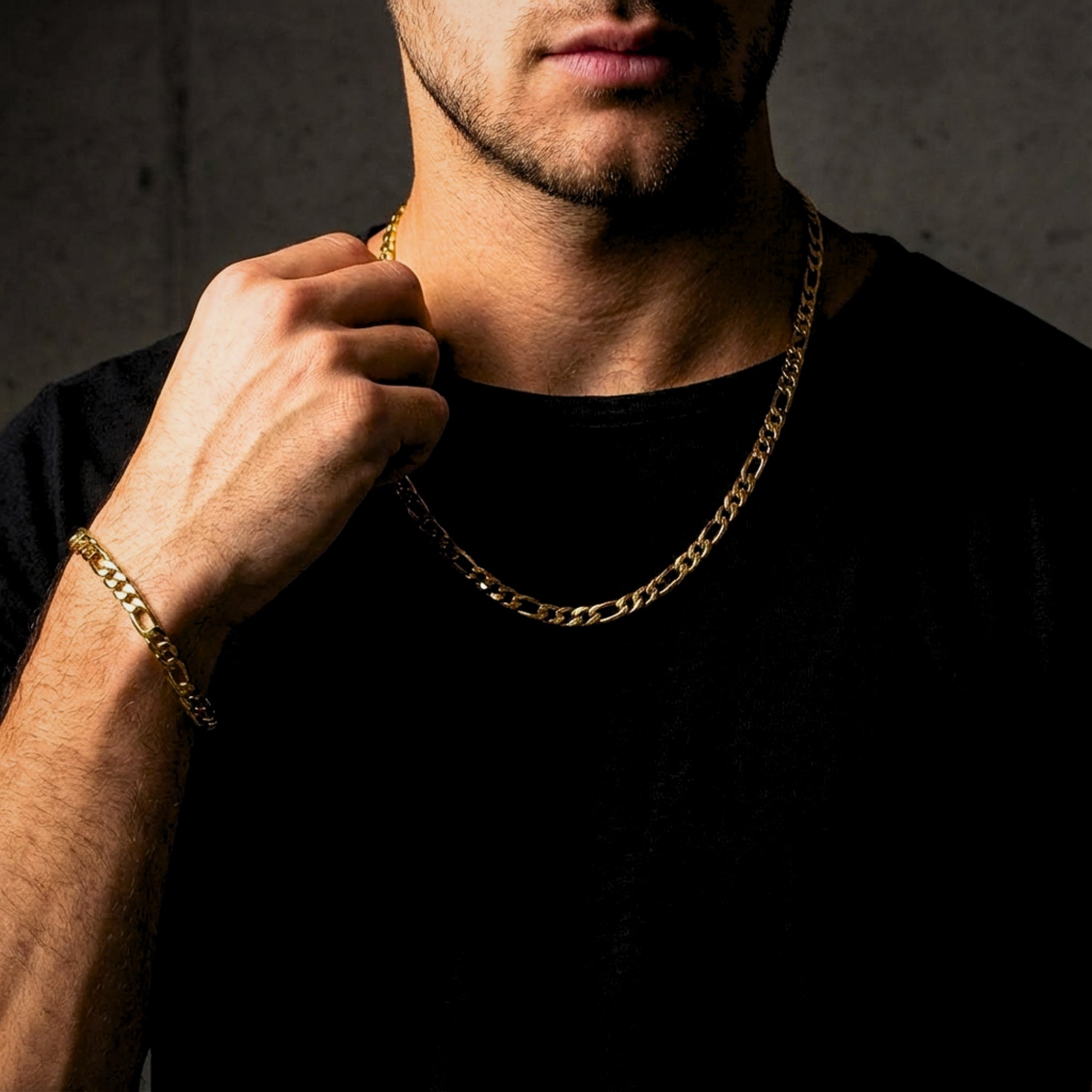 Model wearing the gold stainless steel Figaro duo set, highlighting the 8mm chain and bracelet fit.