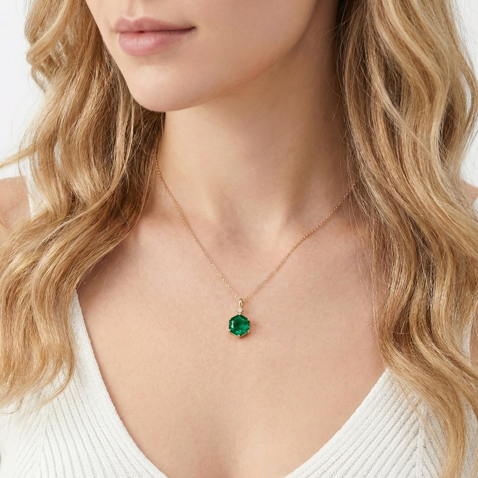 Model wearing the Kyriana geometric necklace with a round simulated emerald in 18K gold vermeil.
