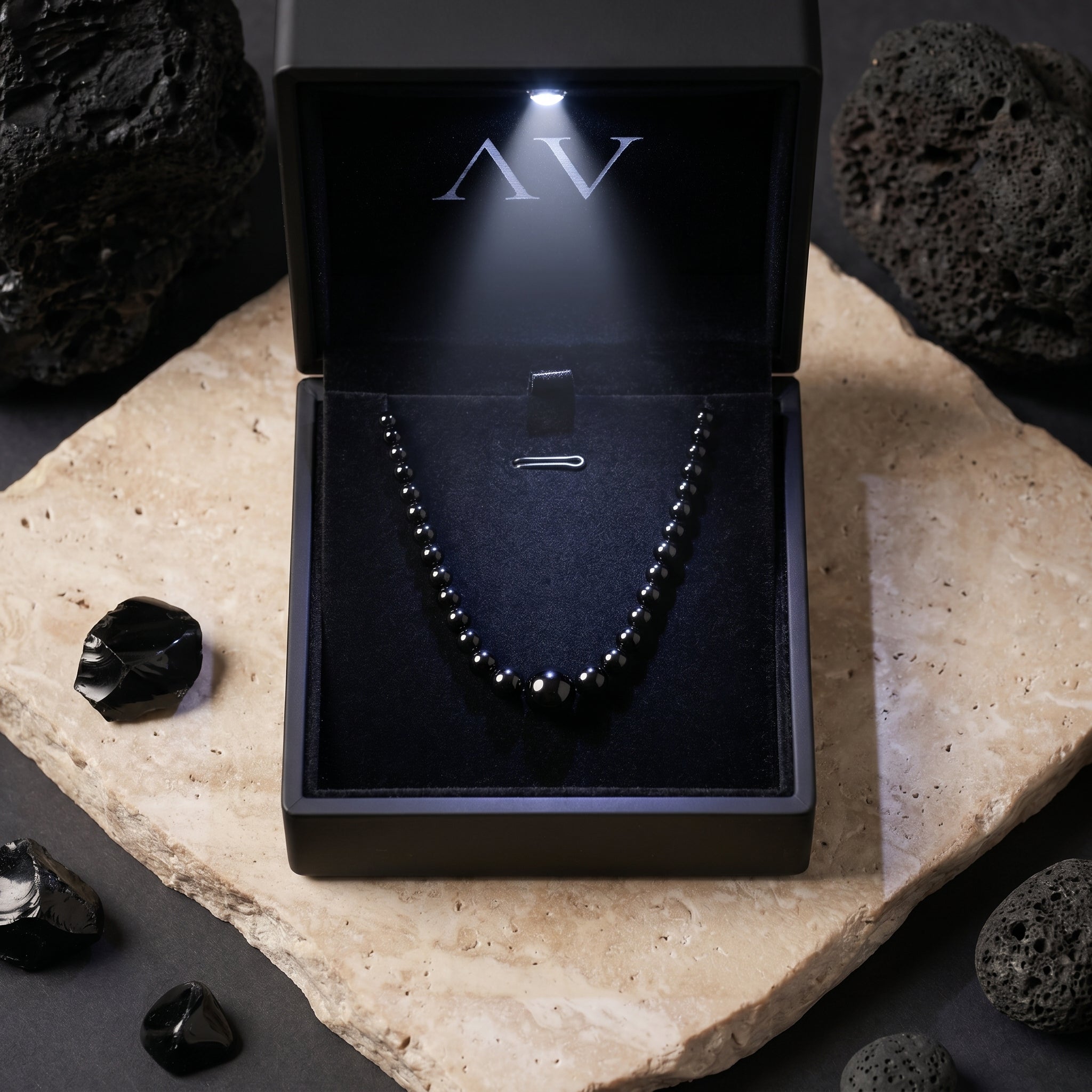 Natural black onyx bead necklace presented in a premium black LED-lit jewelry gift box.