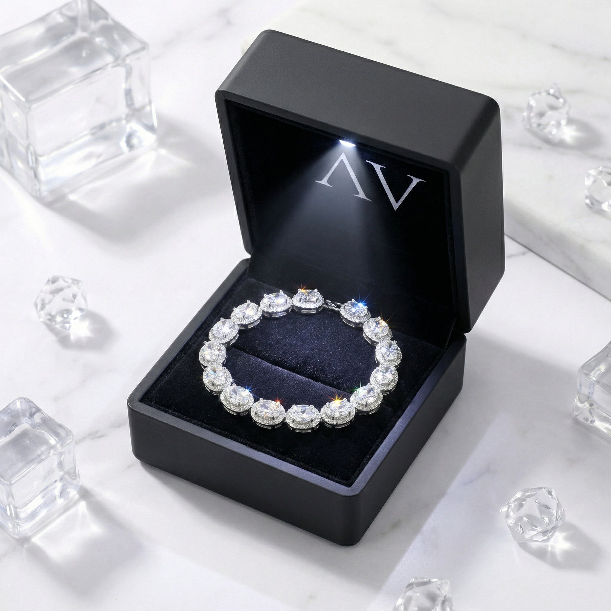 S925 sterling silver oval-cut zirconia halo bracelet presented in a black lighted jewelry gift box.