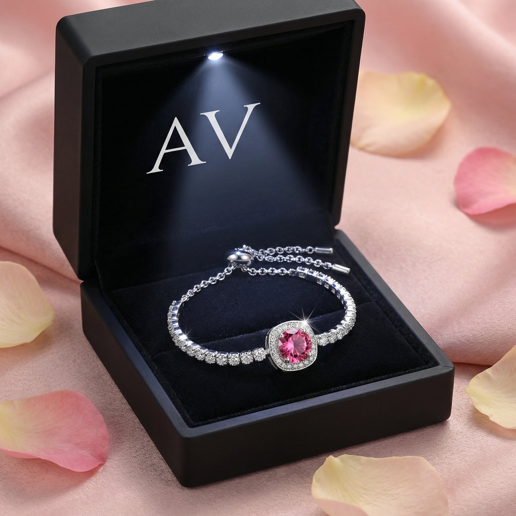 Elianise pink tourmaline halo bracelet in a black lighted jewelry gift box with AV branding.