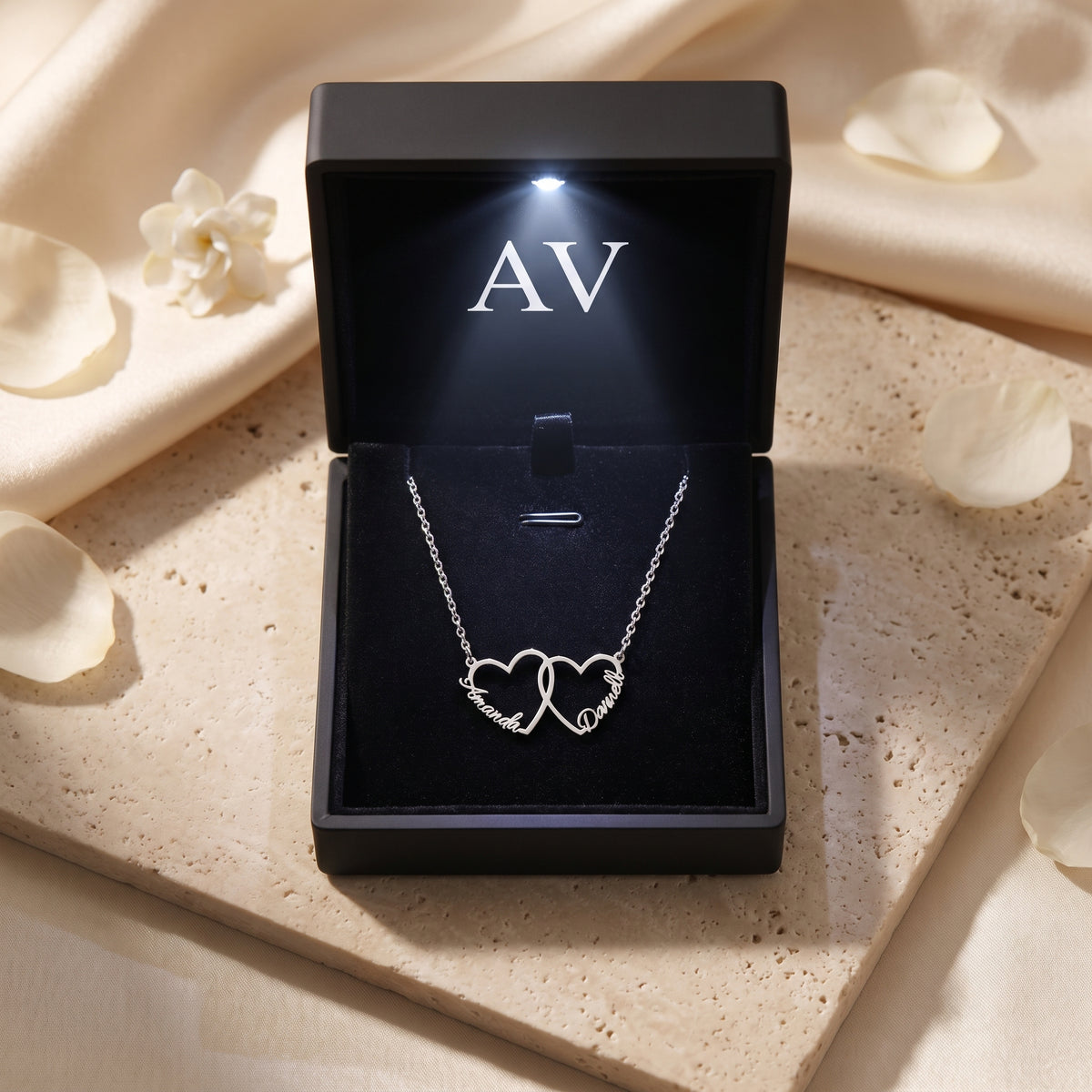 Silver stainless steel interlocking heart necklace in LED gift box.