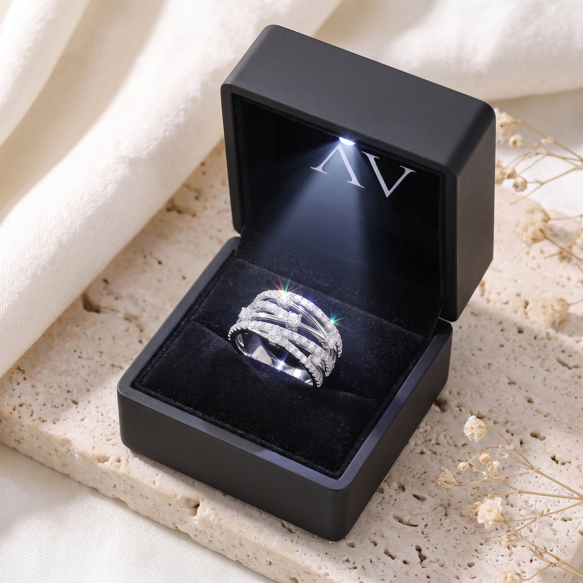 Premium LED Gift Box Presentation for the Aria criss-cross ring in solid white gold.