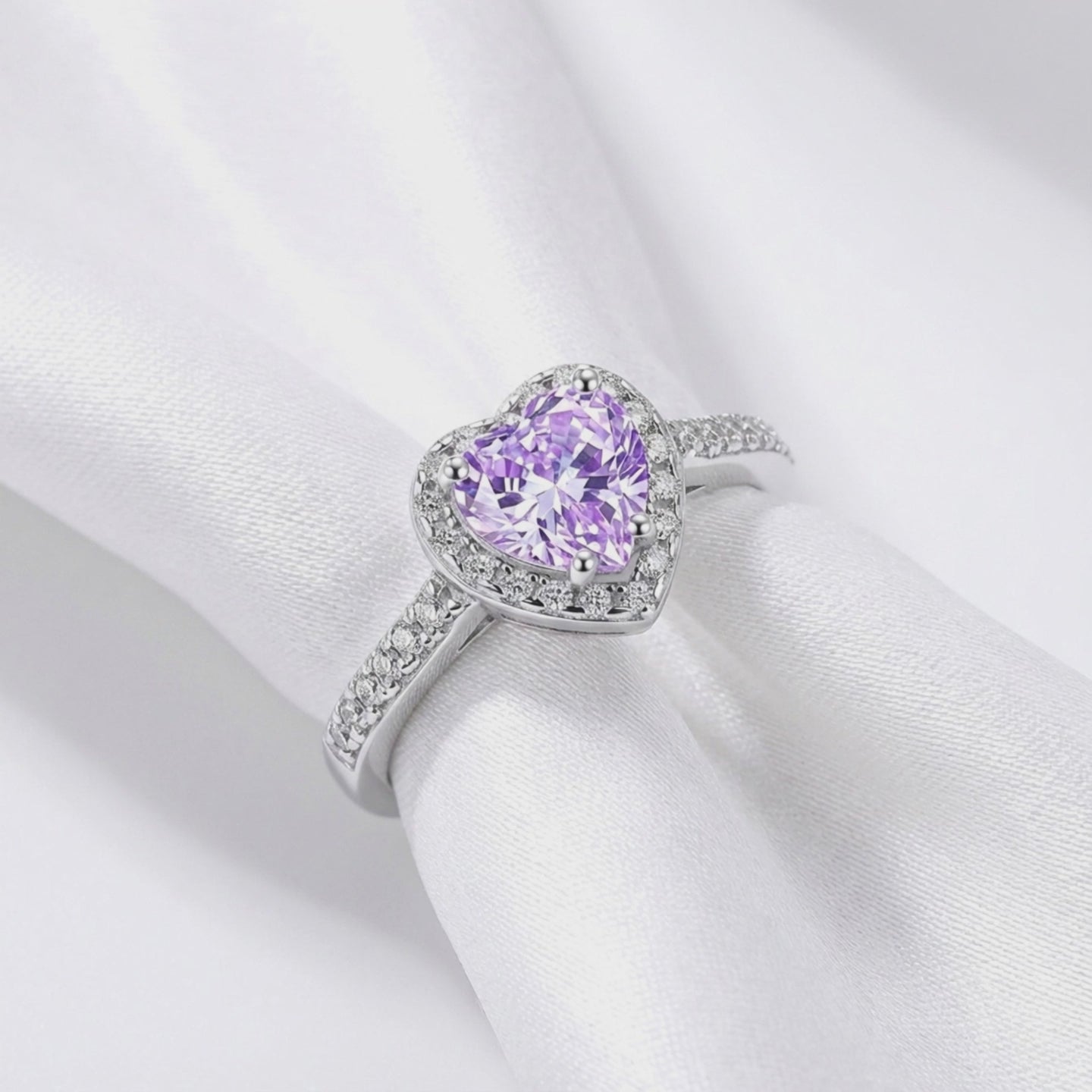 Heart-cut simulated amethyst halo ring in solid gold.
