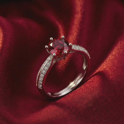 Simulated ruby solitaire ring in solid gold.