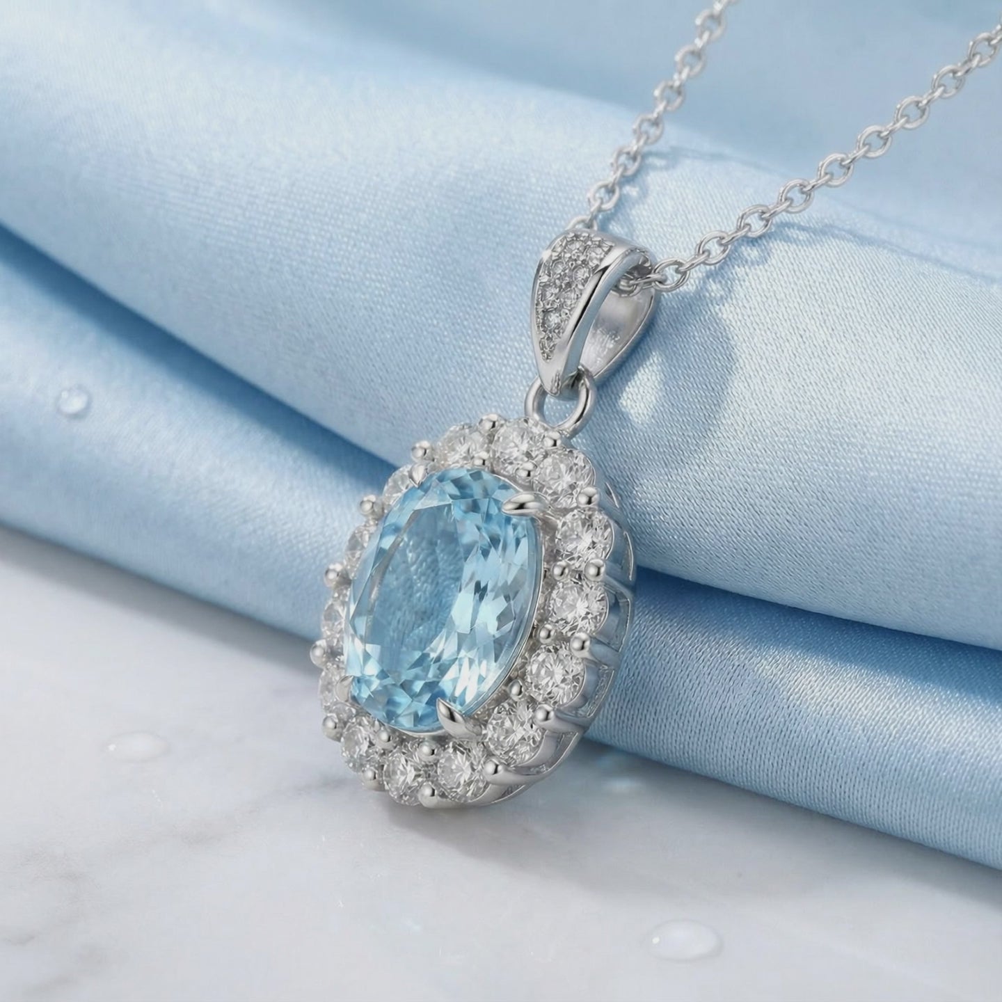Simulated aquamarine halo pendant necklace in solid gold.