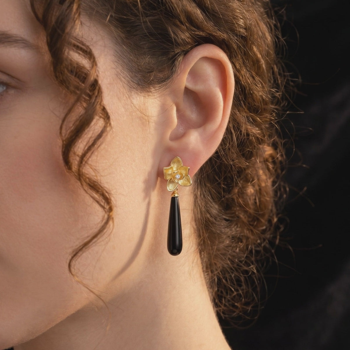 Calla floral black onyx drop earrings in solid gold.