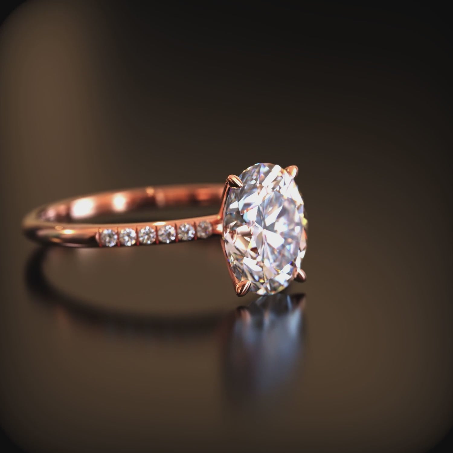 Video of an oval moissanite ring in solid gold.