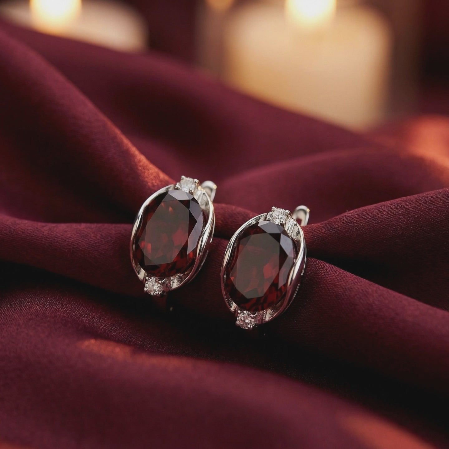 A video detailing the faceted red gemstones of the Alessia solid gold drop earrings.