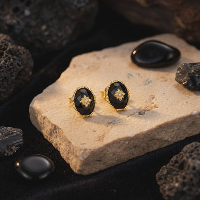 Nerezza black onyx drop earrings in solid gold.