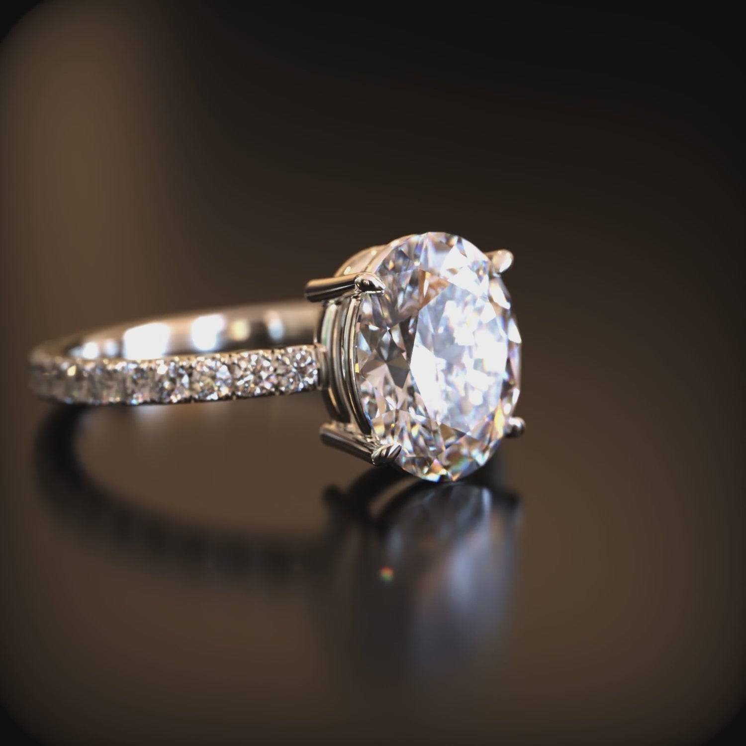 Video of a 14K solid white gold ring with moissanite stones.