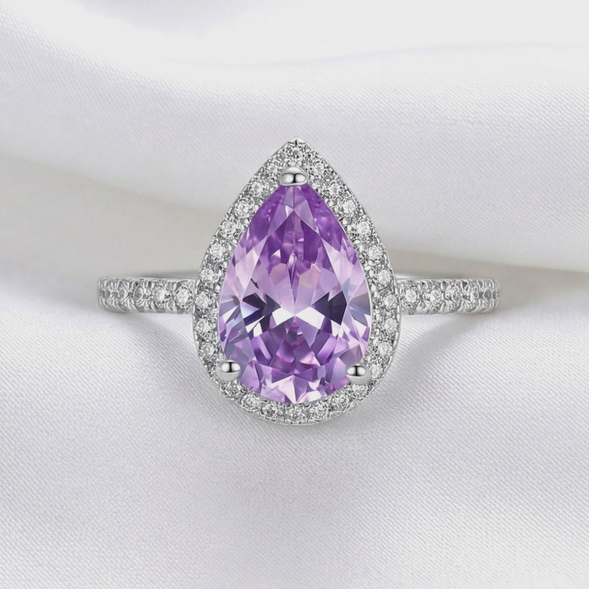 Video of the Odette simulated amethyst halo ring in solid gold.