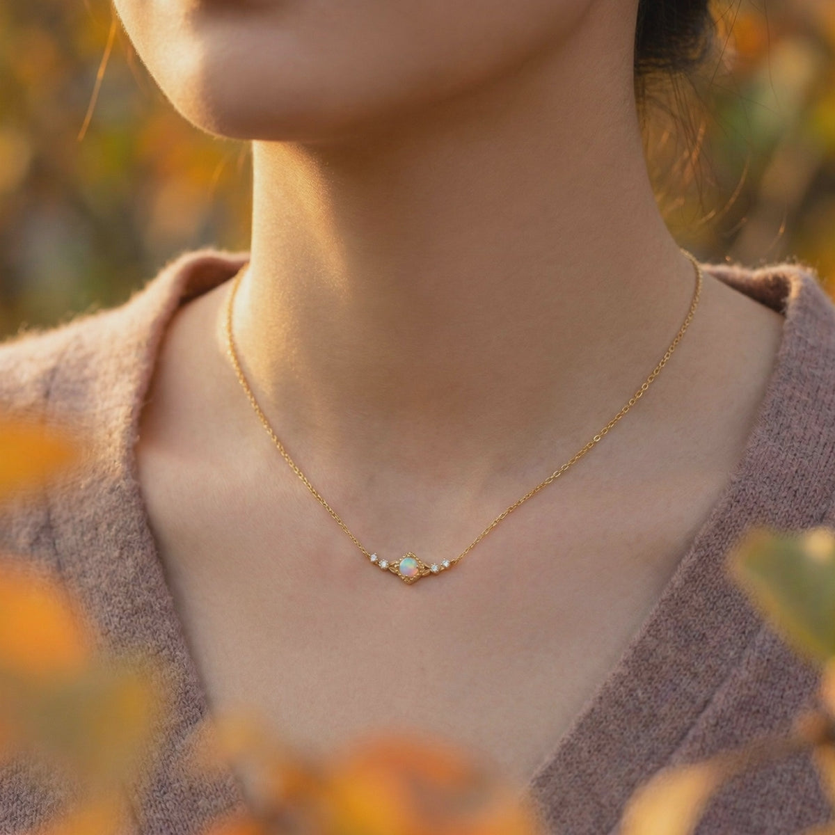 Solid gold necklace with a natural white opal column pendant.