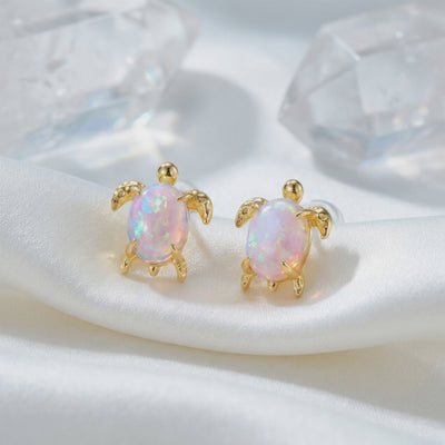 A video showcasing the solid gold Lydiana Oval Opal Stud Earrings.