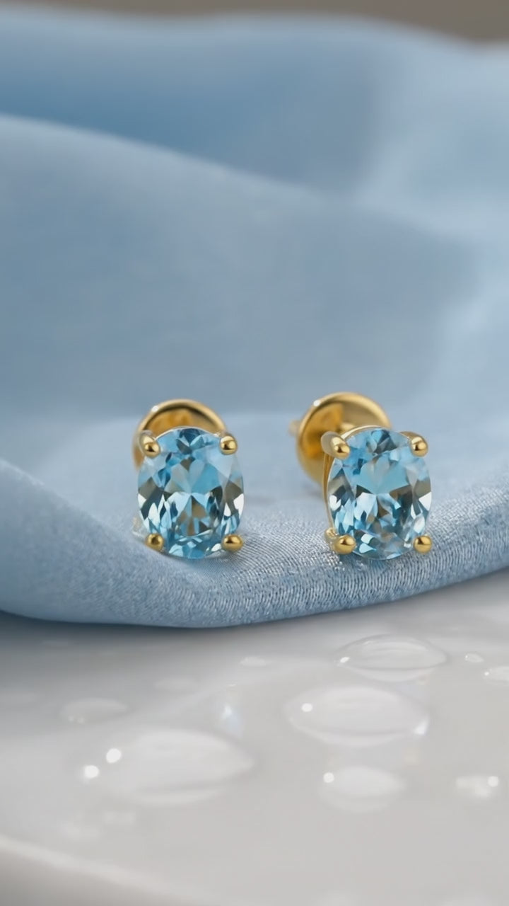 Oval Simulated Aquamarine Solid Gold Stud Earrings.